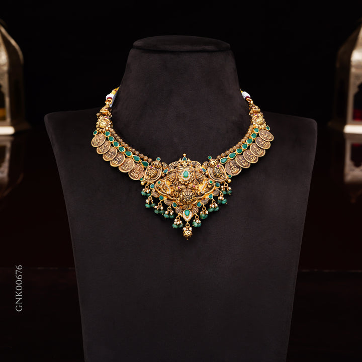 22KT Antique Temple Necklace with Lakshmi Pendant & Green Stones